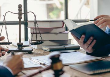 Two people discussing compensation law changes